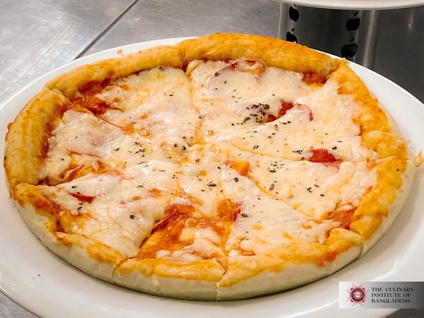 Students learning to make pizza dough