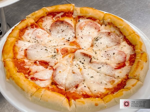 Fresh pizza coming out of the oven